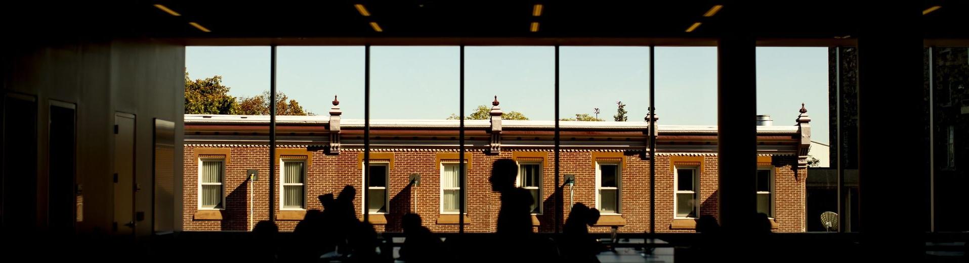 abstract image of students studying in Charles Library.